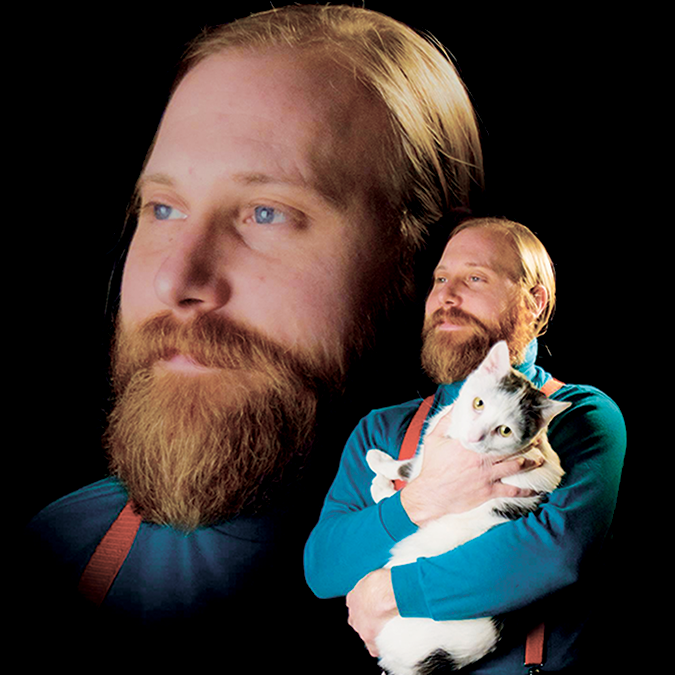 The 'Danimal' holding his cat in an 80's glam shot